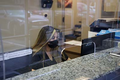 receptionist scheduling a dental appointment for a patient